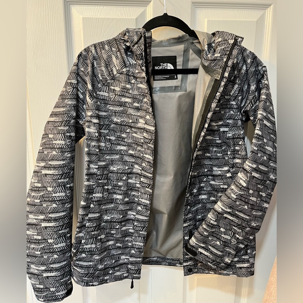 The North Face Women's Novelty Venture Full Zip Hooded Waterproof Rain Jacket.